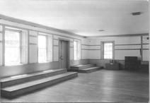 SA0478 - Meeting house interior showing one wall with benches and doorway. Photo associated with the Church Family., Winterthur Shaker Photograph and Post Card Collection 1851 to 1921c